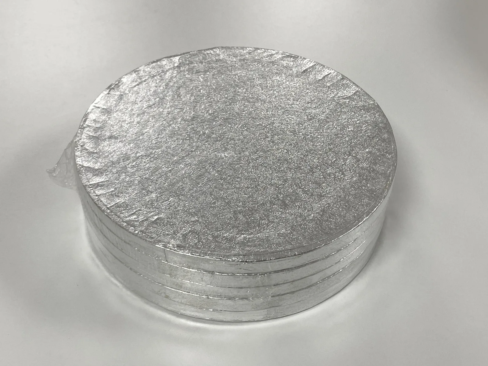 Two packs of five round 8-inch silver cake drums