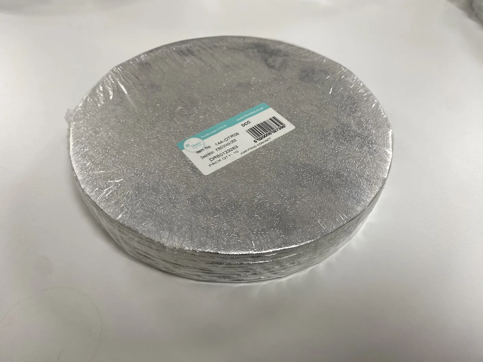 Pack of round 8-inch double-thick silver cake boards