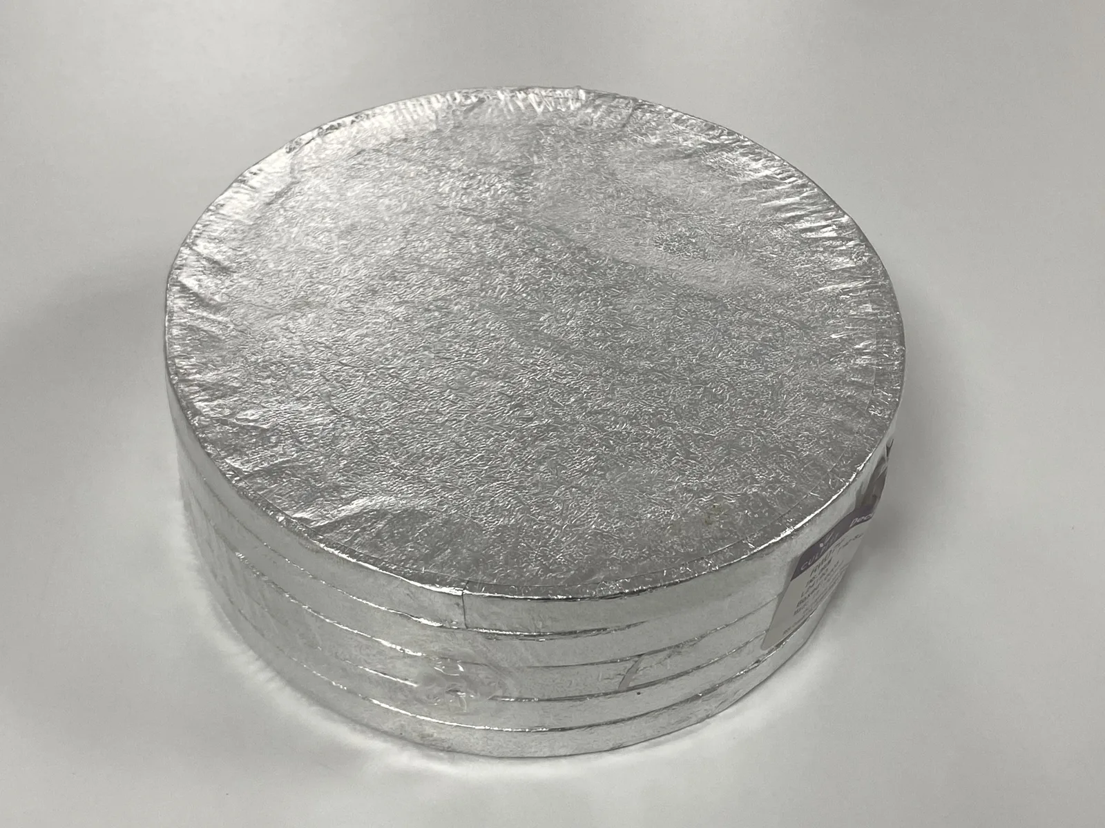Three packs of five round 7-inch silver cake drums