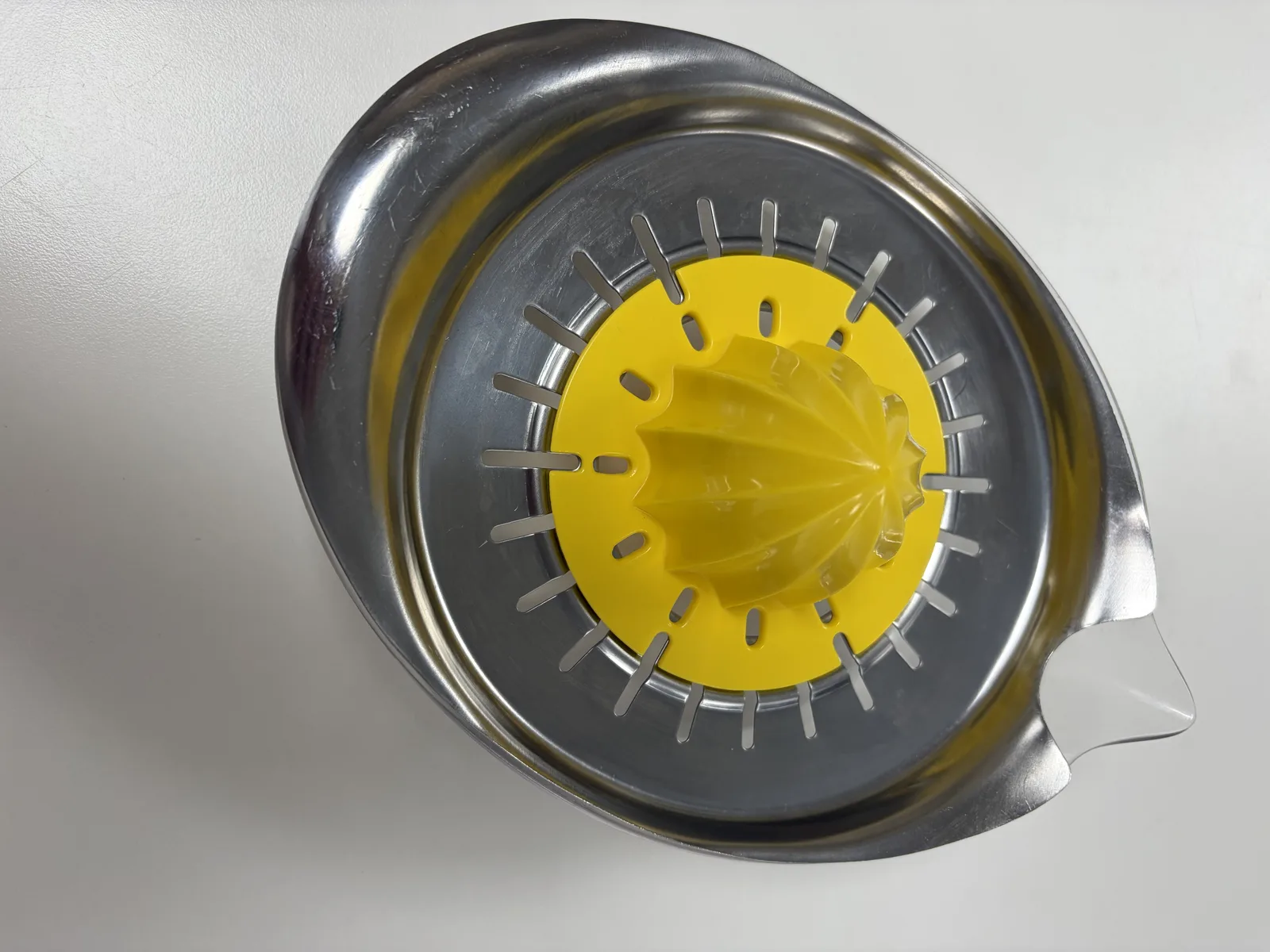 Stainless steel citrus juicer with yellow reamer